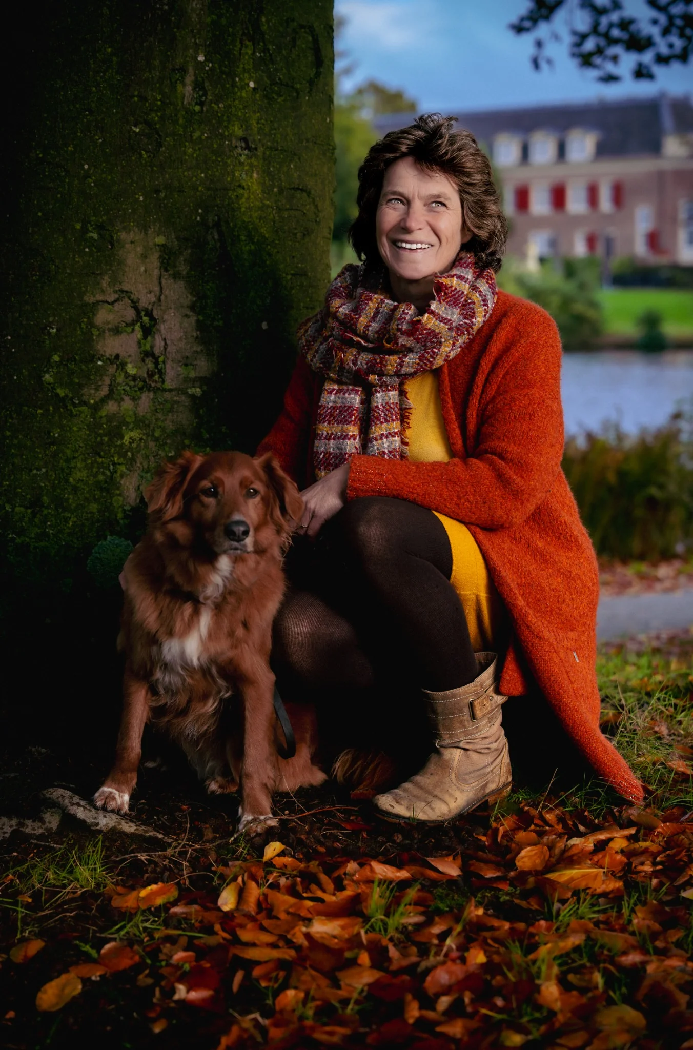 Woman with her dog in an autumn portrait